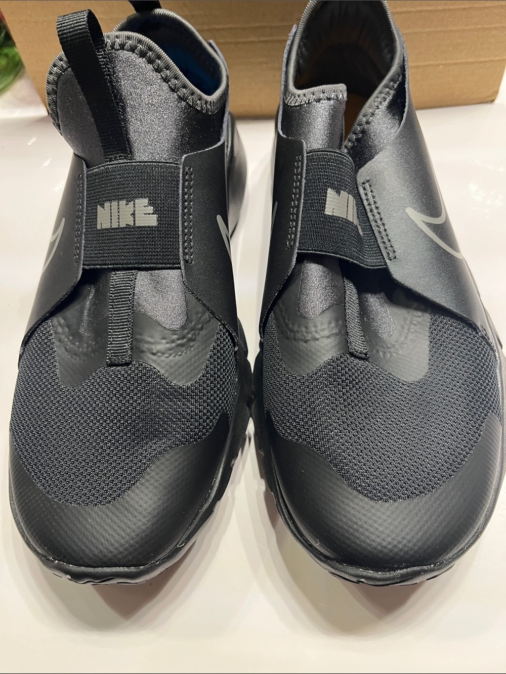 NWOT Nike Black Slip-On Athletic Sneakers with Silver Swoosh